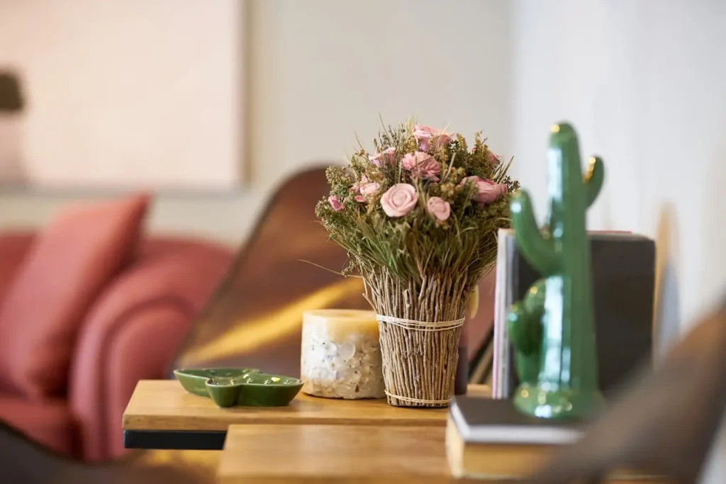 Cozy Home Styling with Floral Table Decor Floral arrangement on wooden table in a cozy modern interior